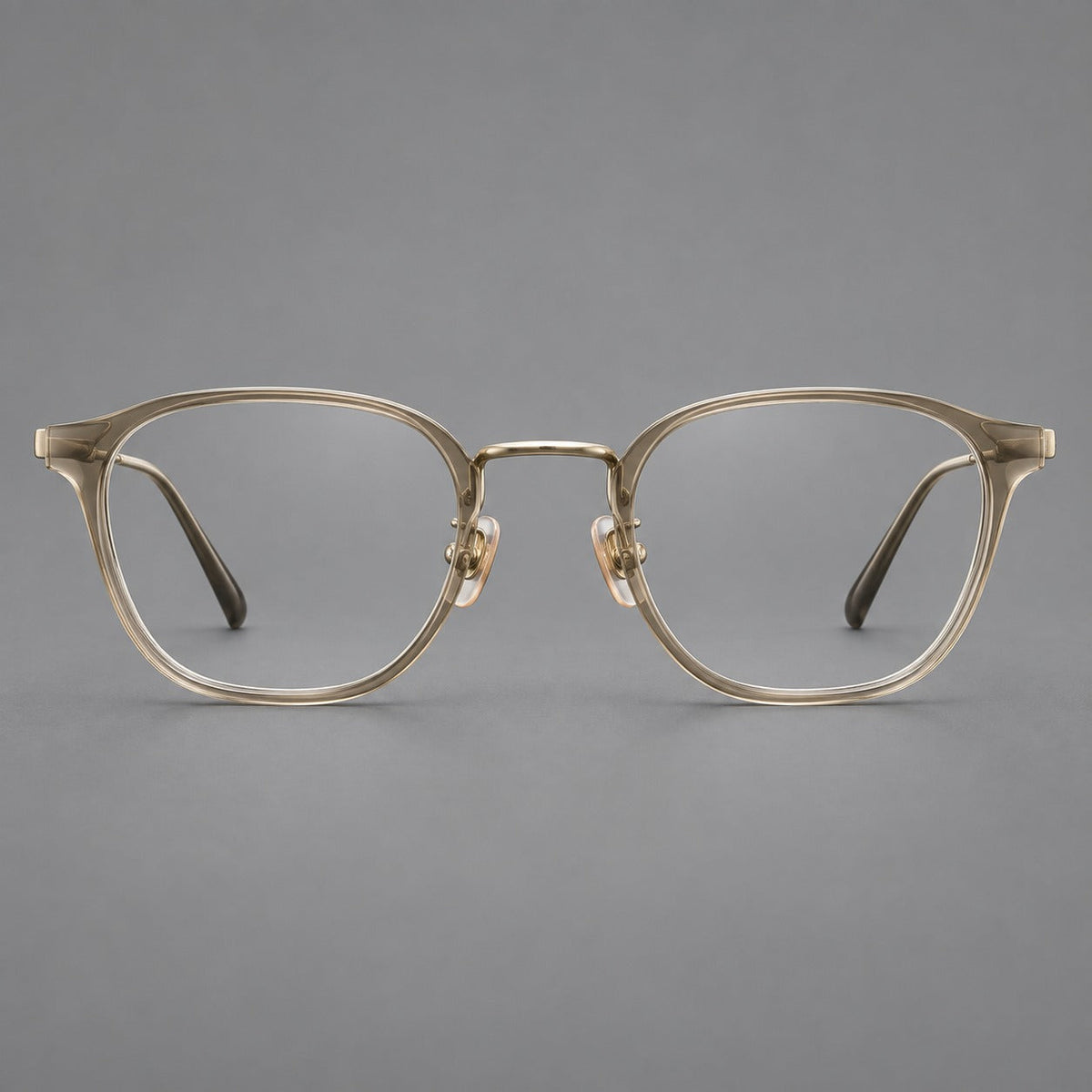 Retro soft square eyeglasses in acetate and titanium with a curved bridge and slender temples in Tea Gradient / Light Gold, front view
