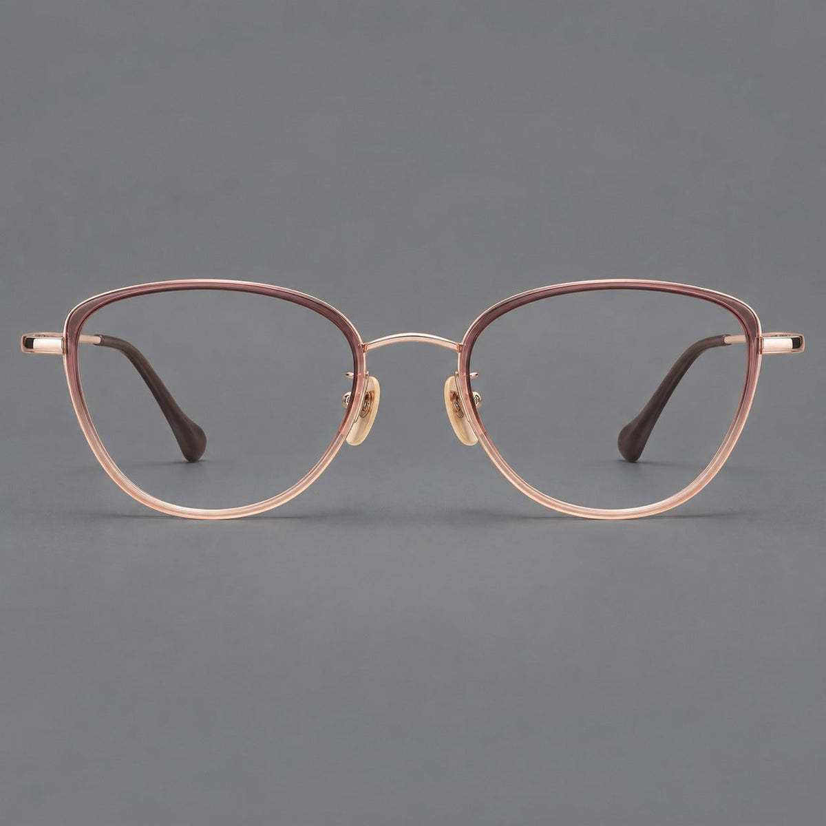 Upswept eyeglasses in acetate and titanium with softly rounded rims and tapered metal temples in Pink Tea Gradient / Rose Gold, front view