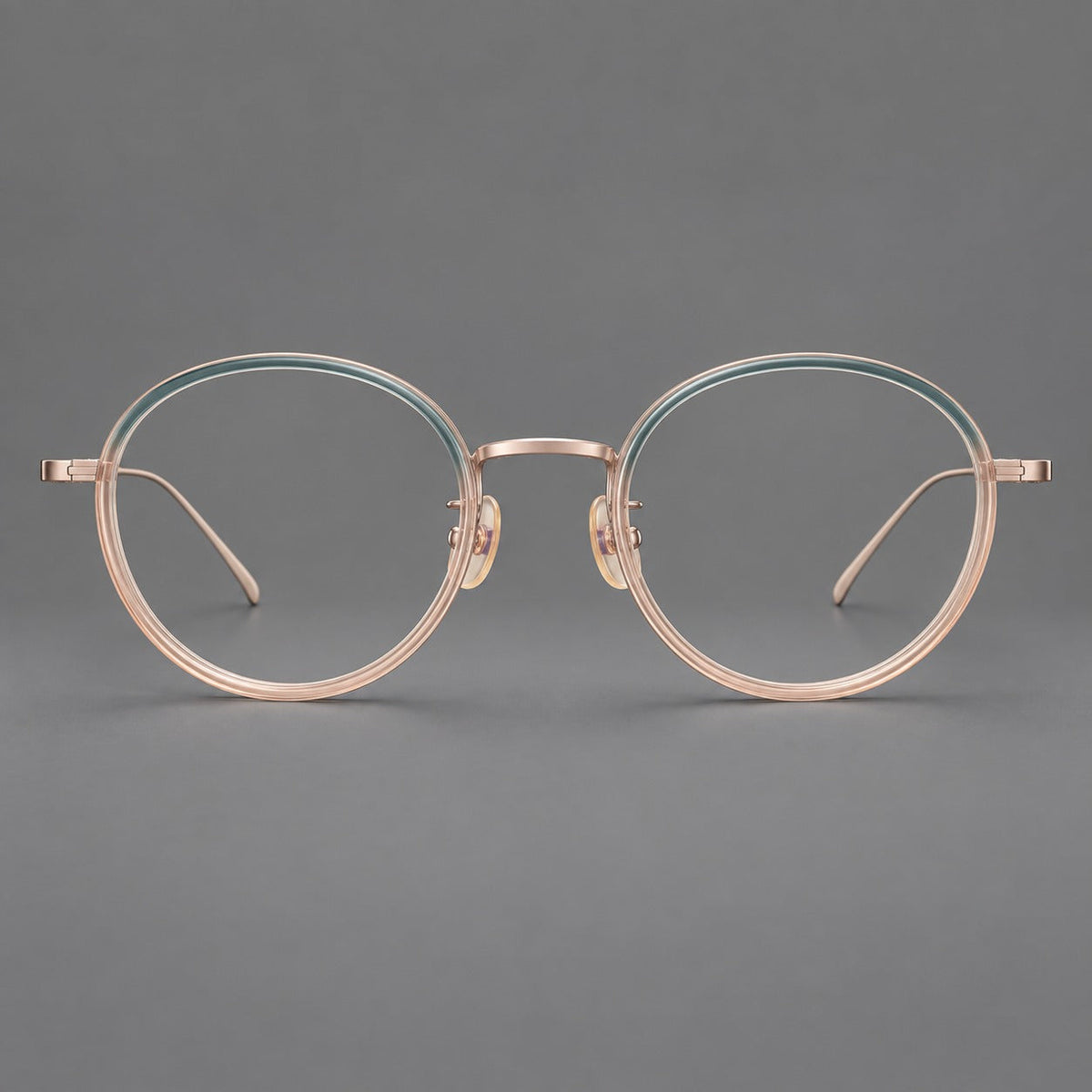 Classic round eyeglasses in acetate and titanium with slim rims and textured metal temples in Blue Tea Gradient / Rose Gold, front view
