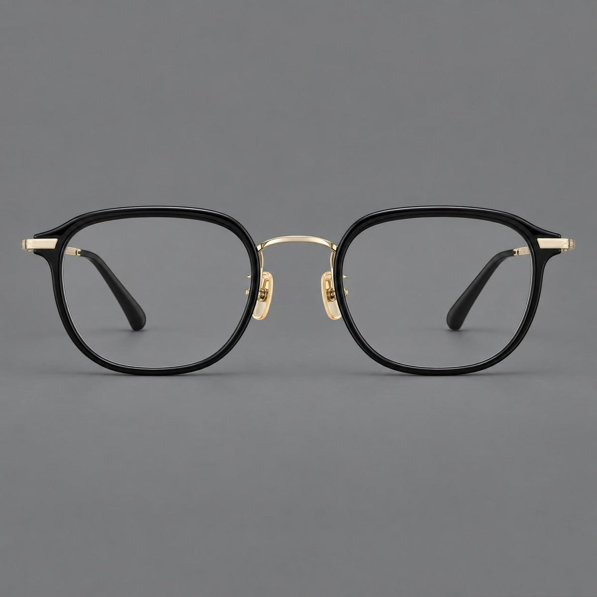Soft square eyeglasses in acetate and titanium with rounded corners and decorative metal temples in Matte Black / Light Gold, front view