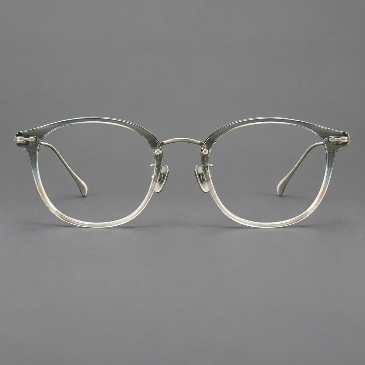 Panto eyeglasses in acetate and titanium with curved brows and decorative metal corner accents in Ice Blue Tea / Silver, front view