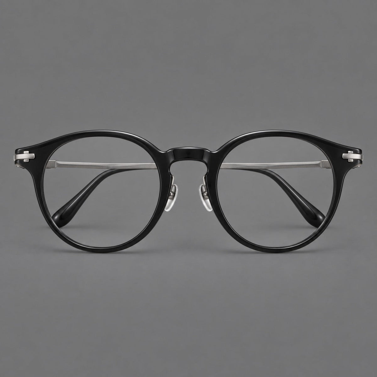 Retro acetate and titanium eyeglasses with round rims and a pronounced keyhole bridge in Black / Gray, front view
