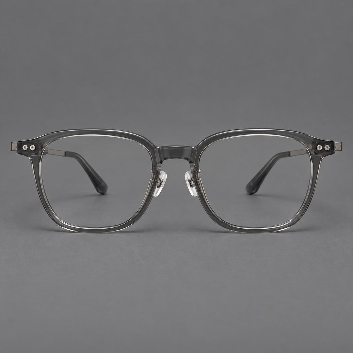 Vintage acetate and titanium eyeglasses with rounded square rims and slotted metal temples in Clear Gray, front view