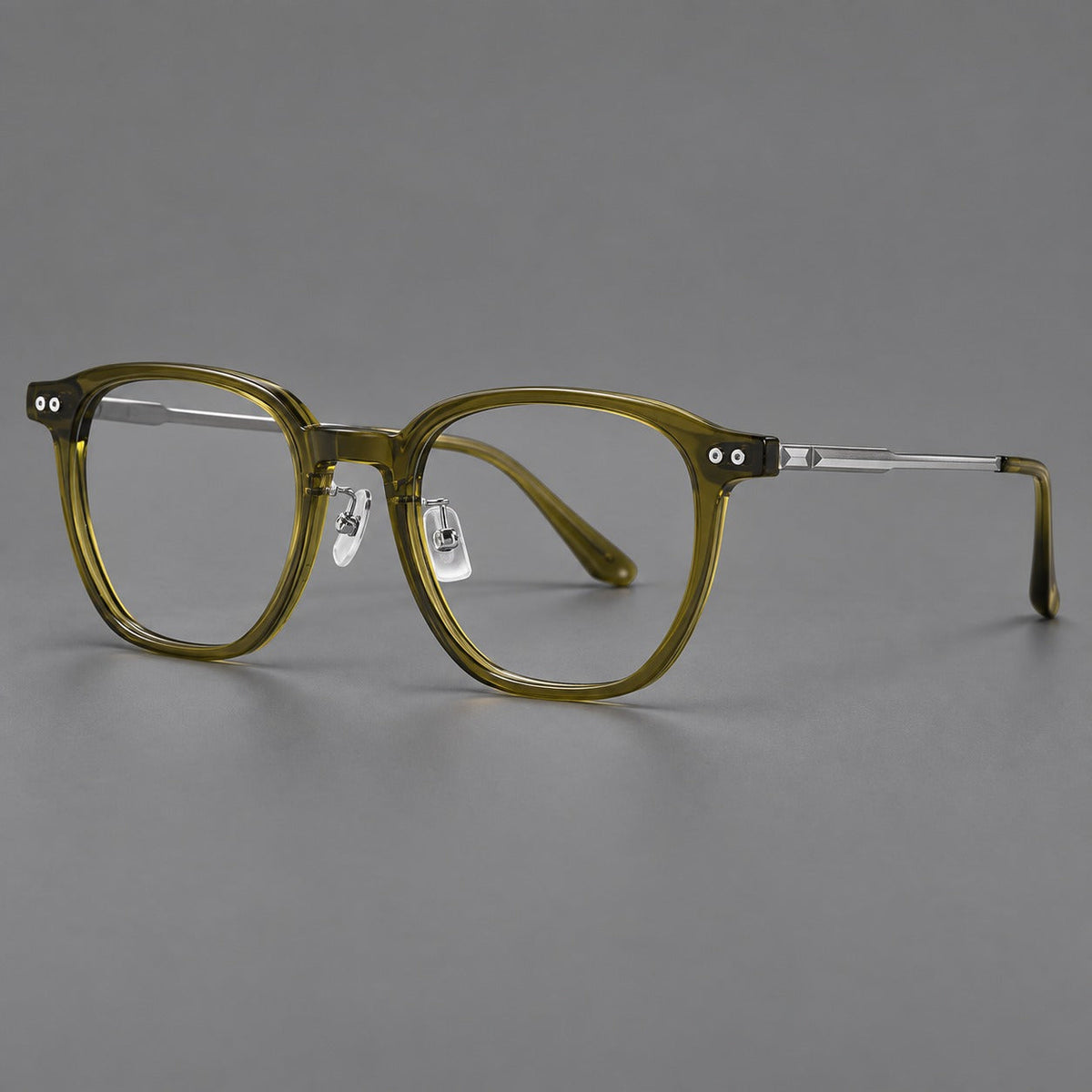 Vintage acetate and titanium eyeglasses with rounded square rims and slotted metal temples in Clear Olive Green / Silver, three quarter view
