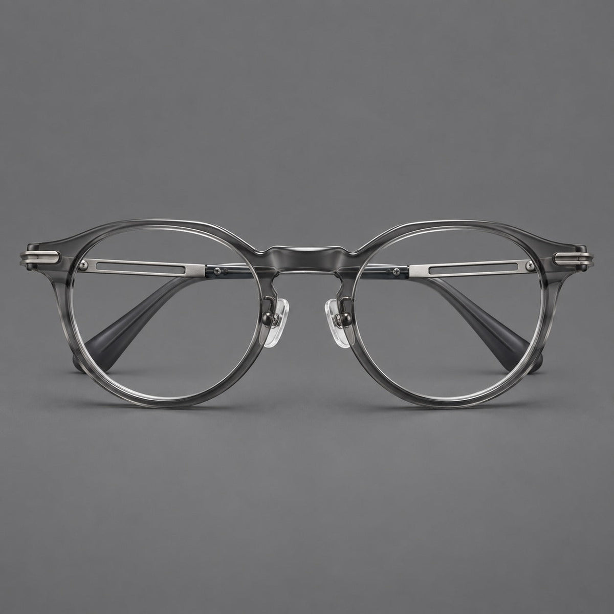 Retro acetate and titanium eyeglasses with round rims and distinctive looped metal joints in Clear Gray / Brushed Gray, front view