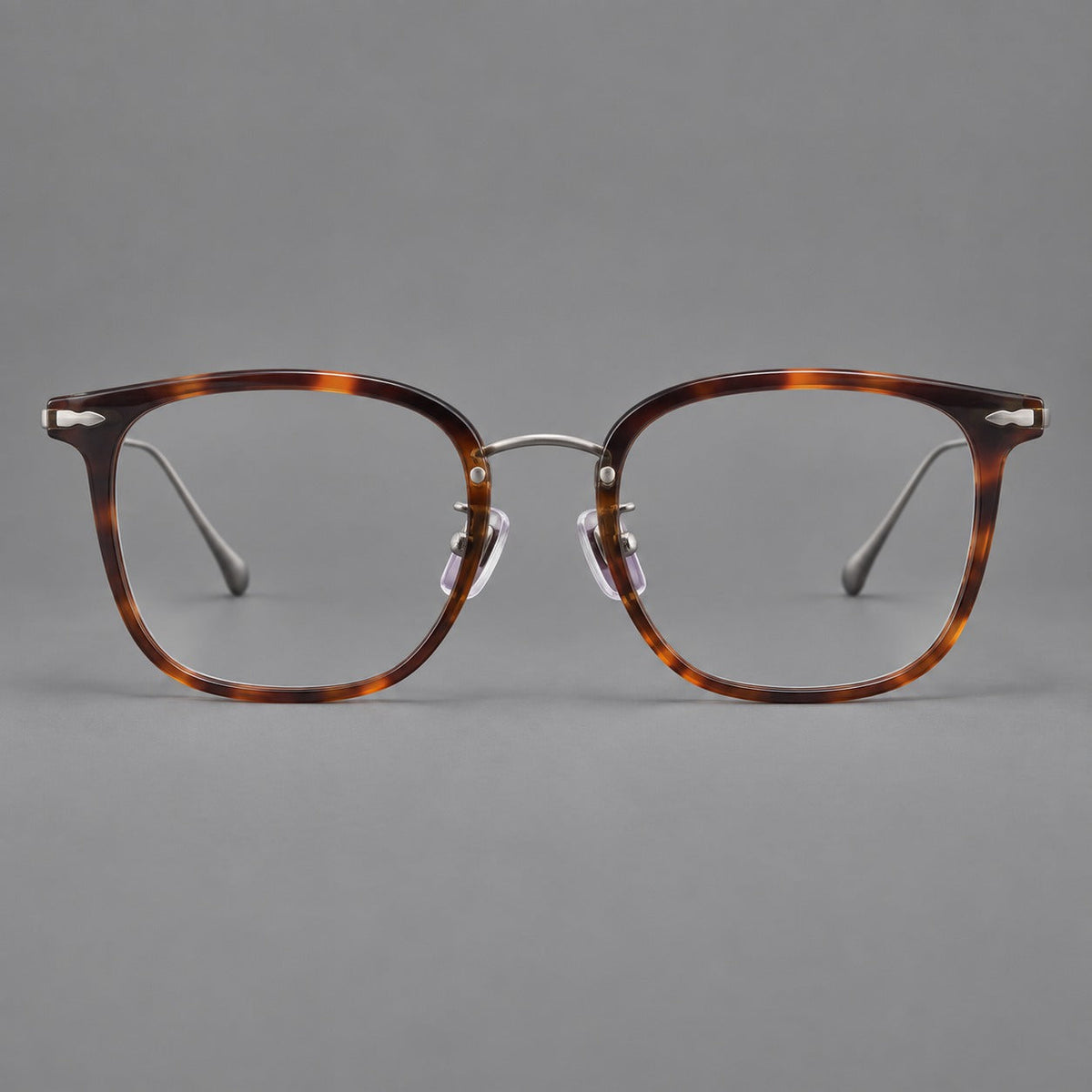 Retro square eyeglasses in acetate and titanium with rounded edges and sculpted corner accents in Tortoiseshell / Antique Copper, front view