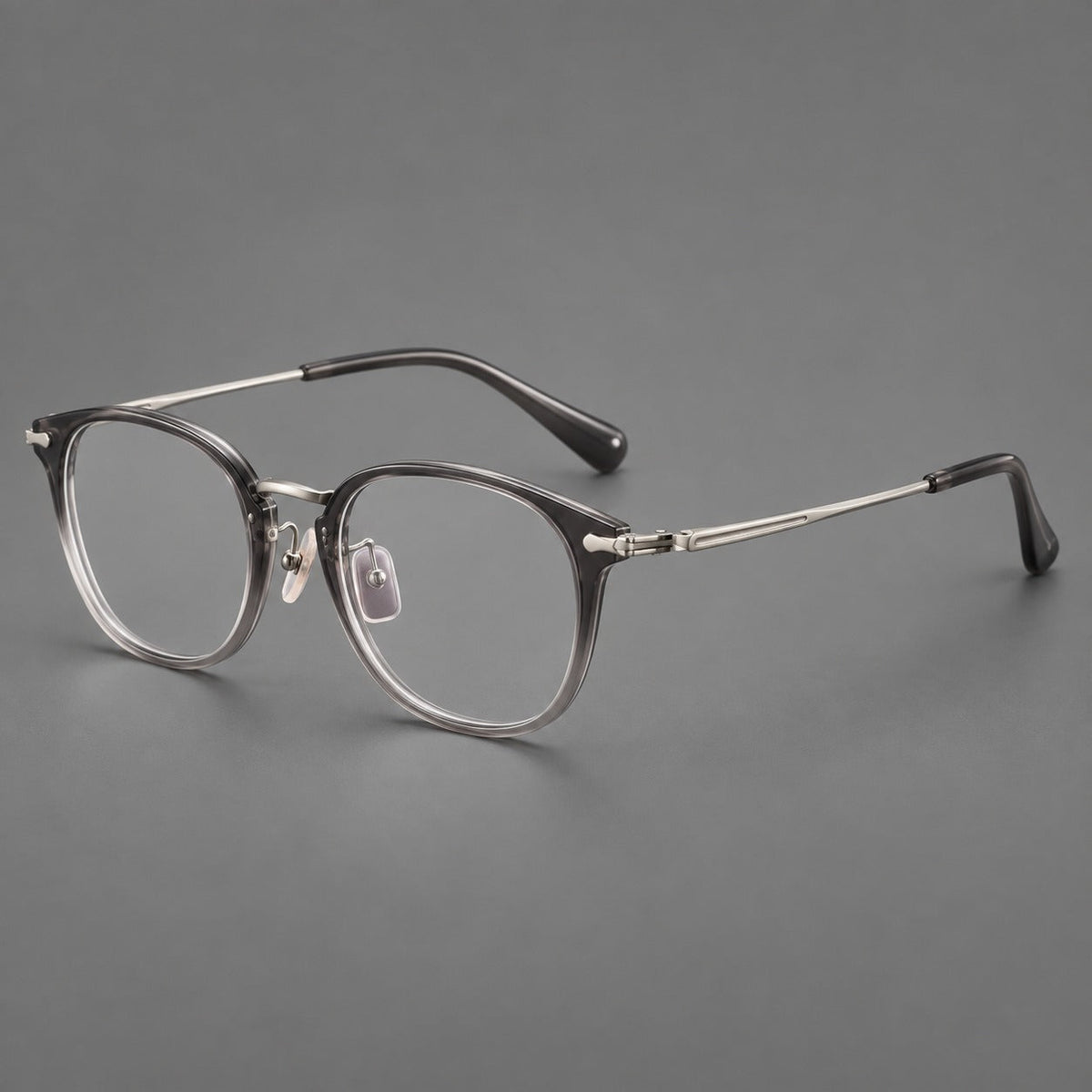 Classic soft square eyeglasses in acetate and titanium with engraved temples and corner accents in Mist Gray / Silver, three quarter view
