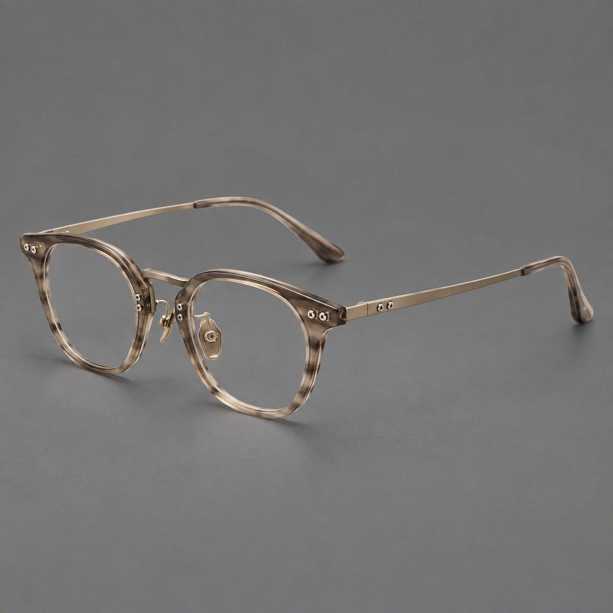 Retro acetate and titanium eyeglasses with softly rounded rims and a metal bridge in Light Gray Woodgrain, three quarter view