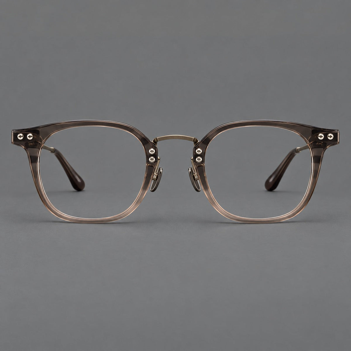 Retro acetate and titanium eyeglasses with softly rounded rims and a metal bridge in Coffee Brown, front view