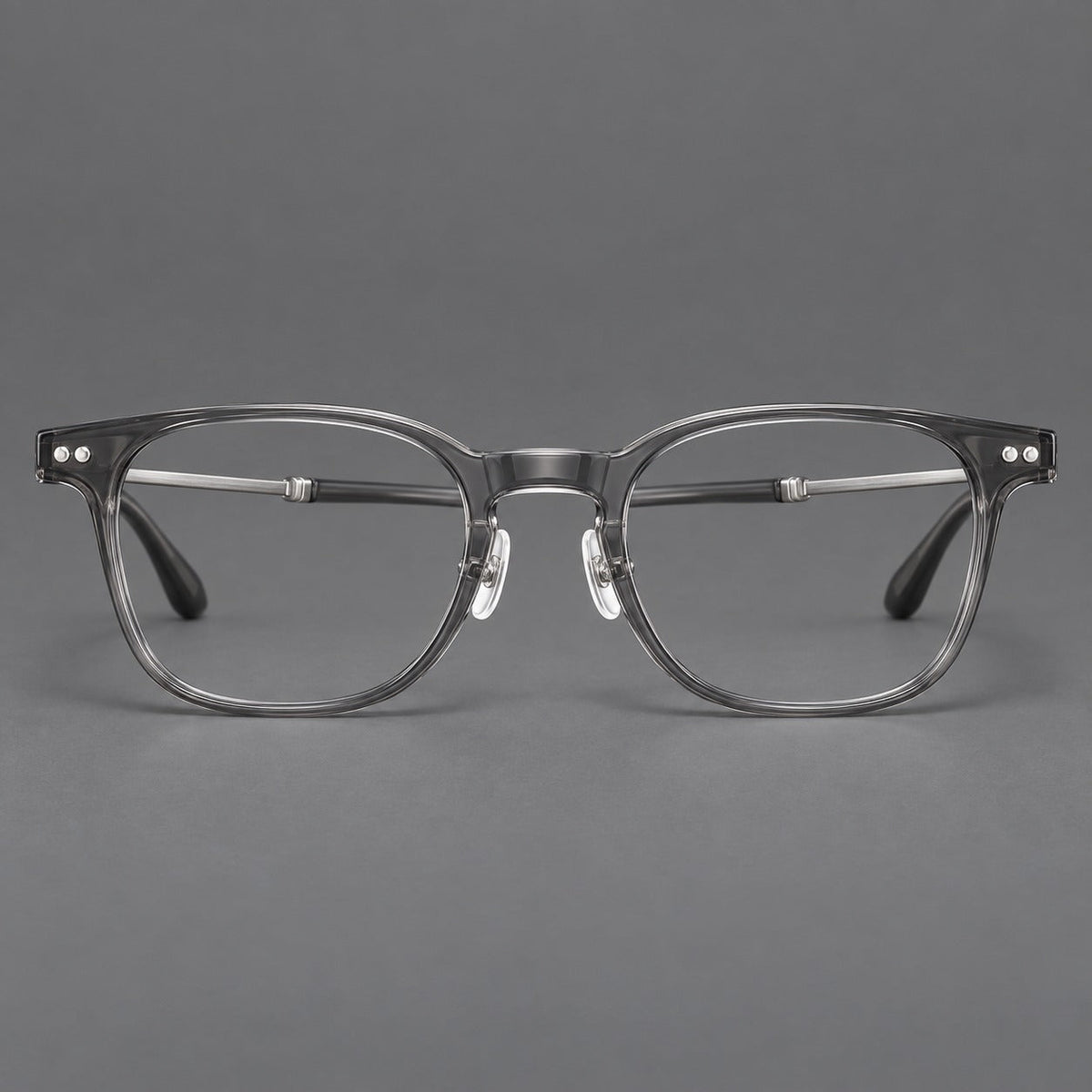 Vintage acetate and titanium eyeglasses with soft square rims and paired metal rivets in Clear Gray / Brushed Gray, front view