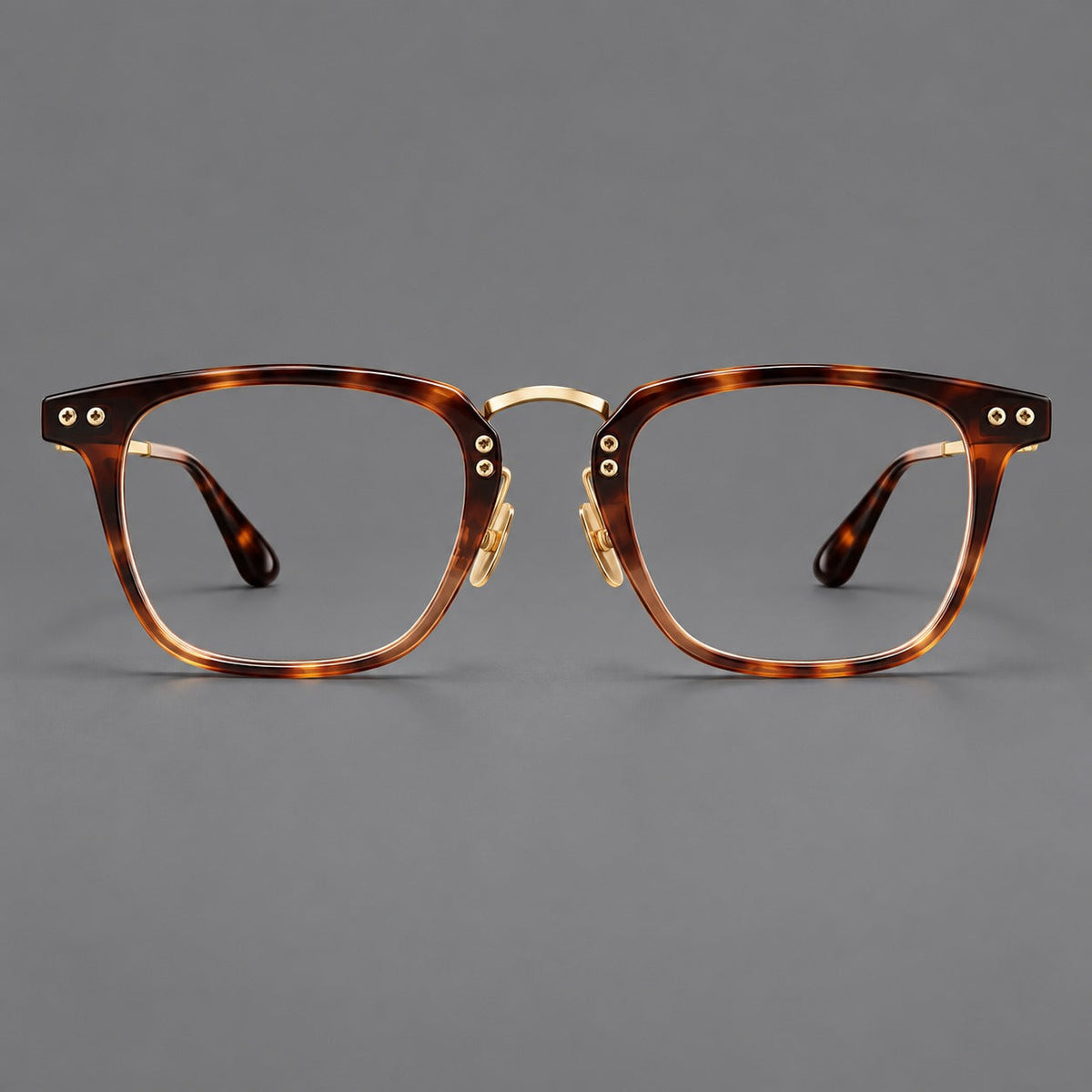Acetate and titanium eyeglasses with soft square rims and an arched metal bridge in Tortoiseshell / Gold, front view