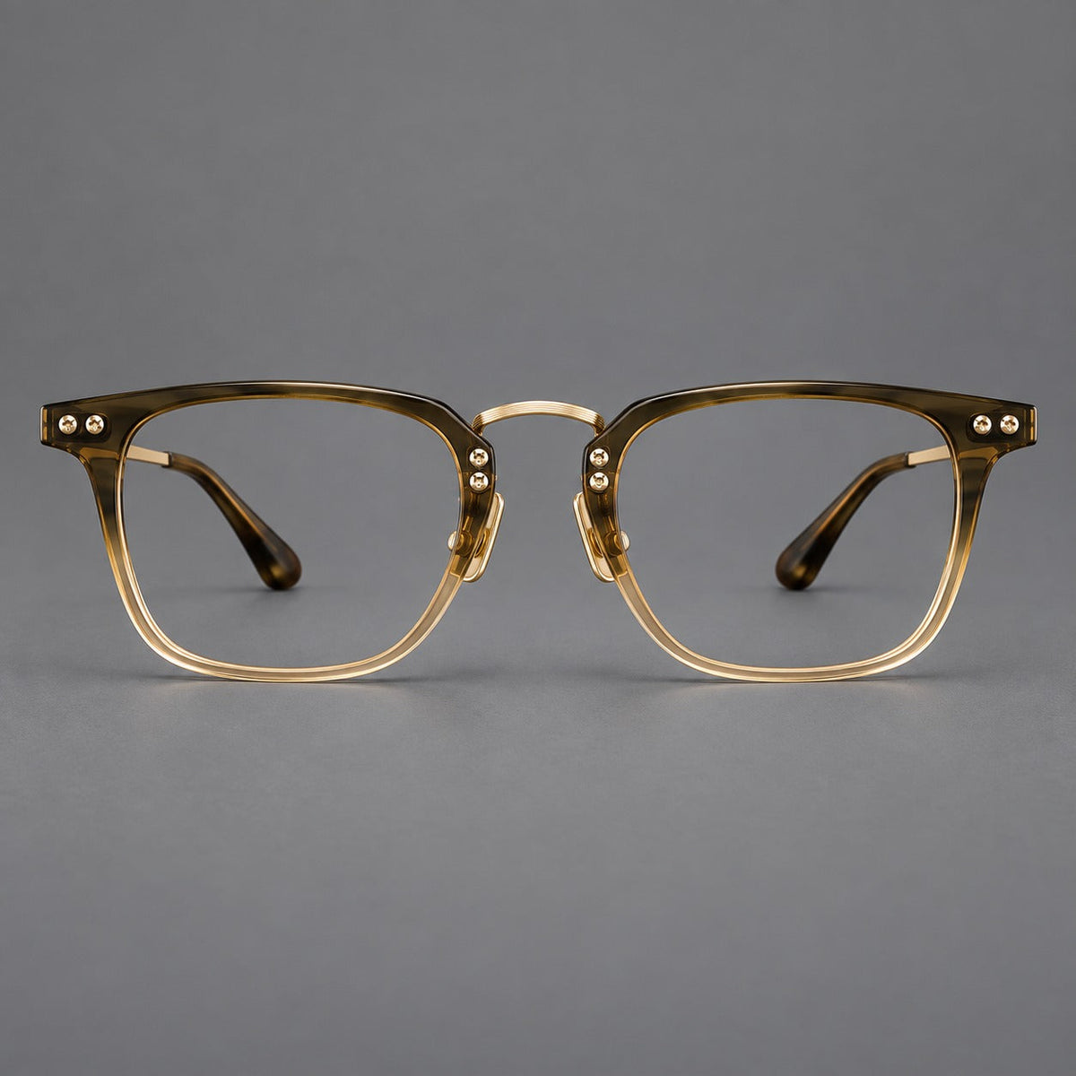 Acetate and titanium eyeglasses with soft square rims and an arched metal bridge in Tea Gradient / Gold, front view