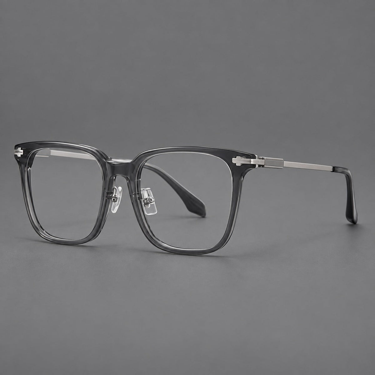 Classic acetate and titanium eyeglasses with broad square rims and textured metal temples in Clear Gray / Silver, three quarter view
