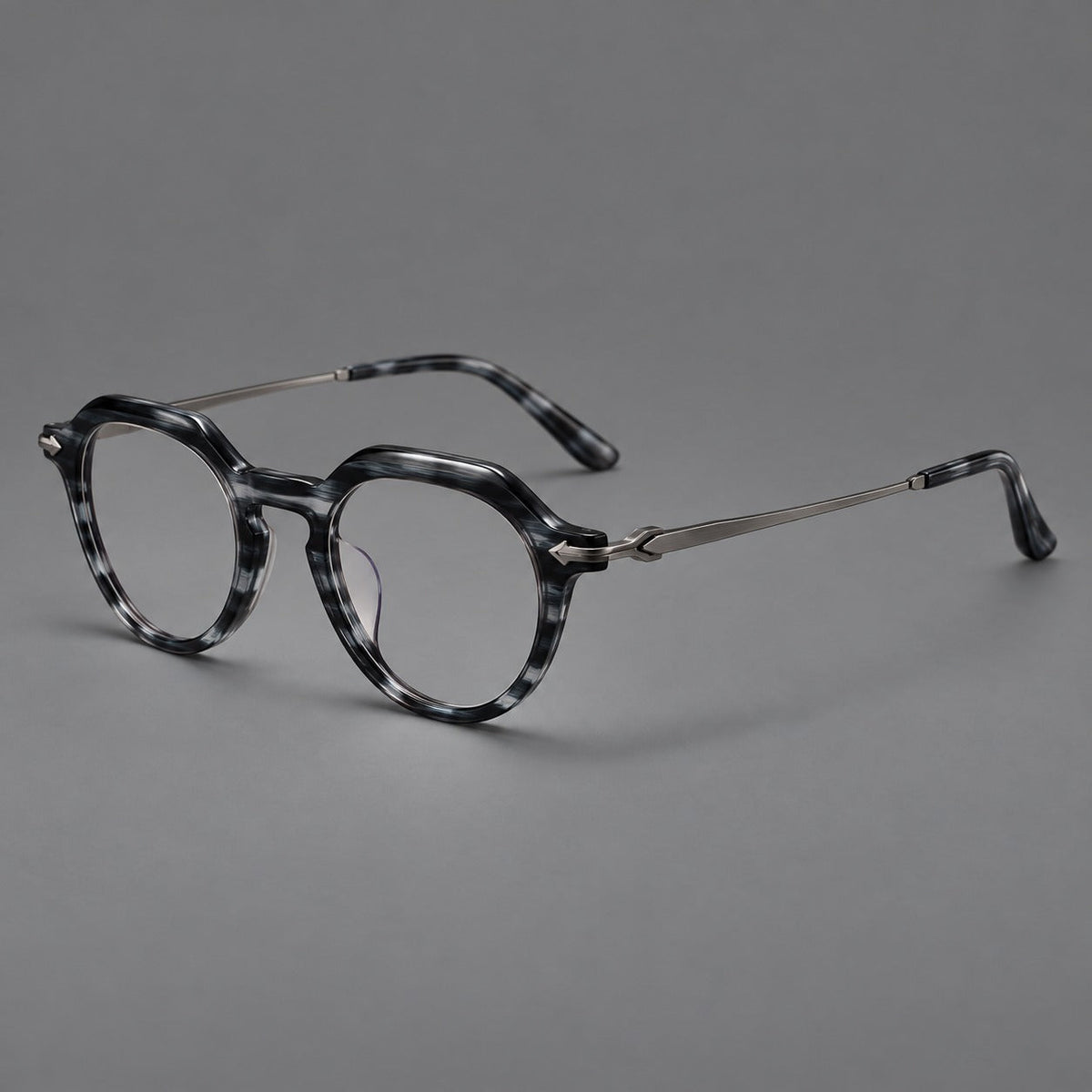 Retro acetate and titanium eyeglasses with panto rims and decorative arrow corner accents in Gray Blue Woodgrain / Gunmetal, three quarter view