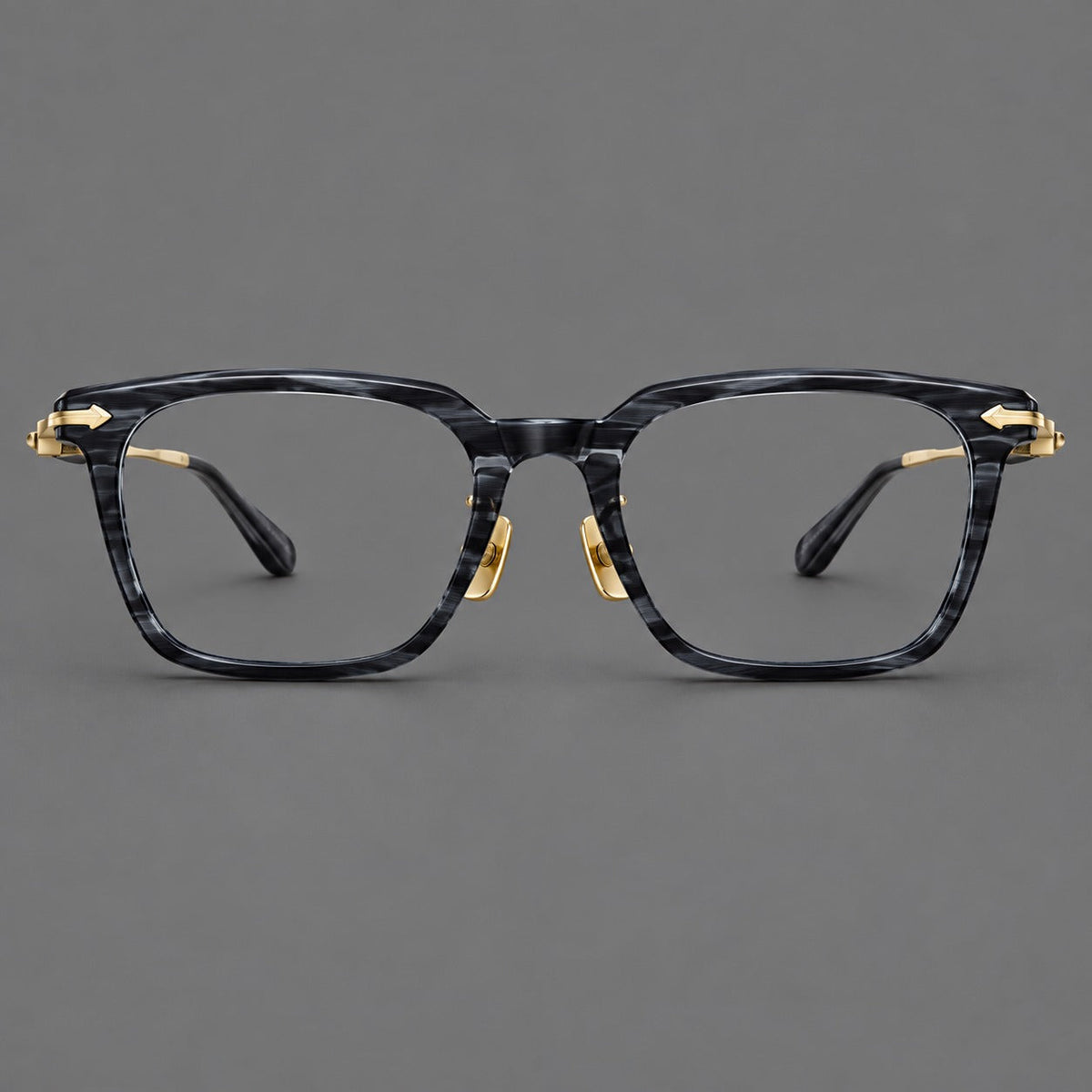 Bold acetate and titanium eyeglasses with rectangular rims and sculpted arrow accents in Gray Blue Woodgrain / Light Gold, front view