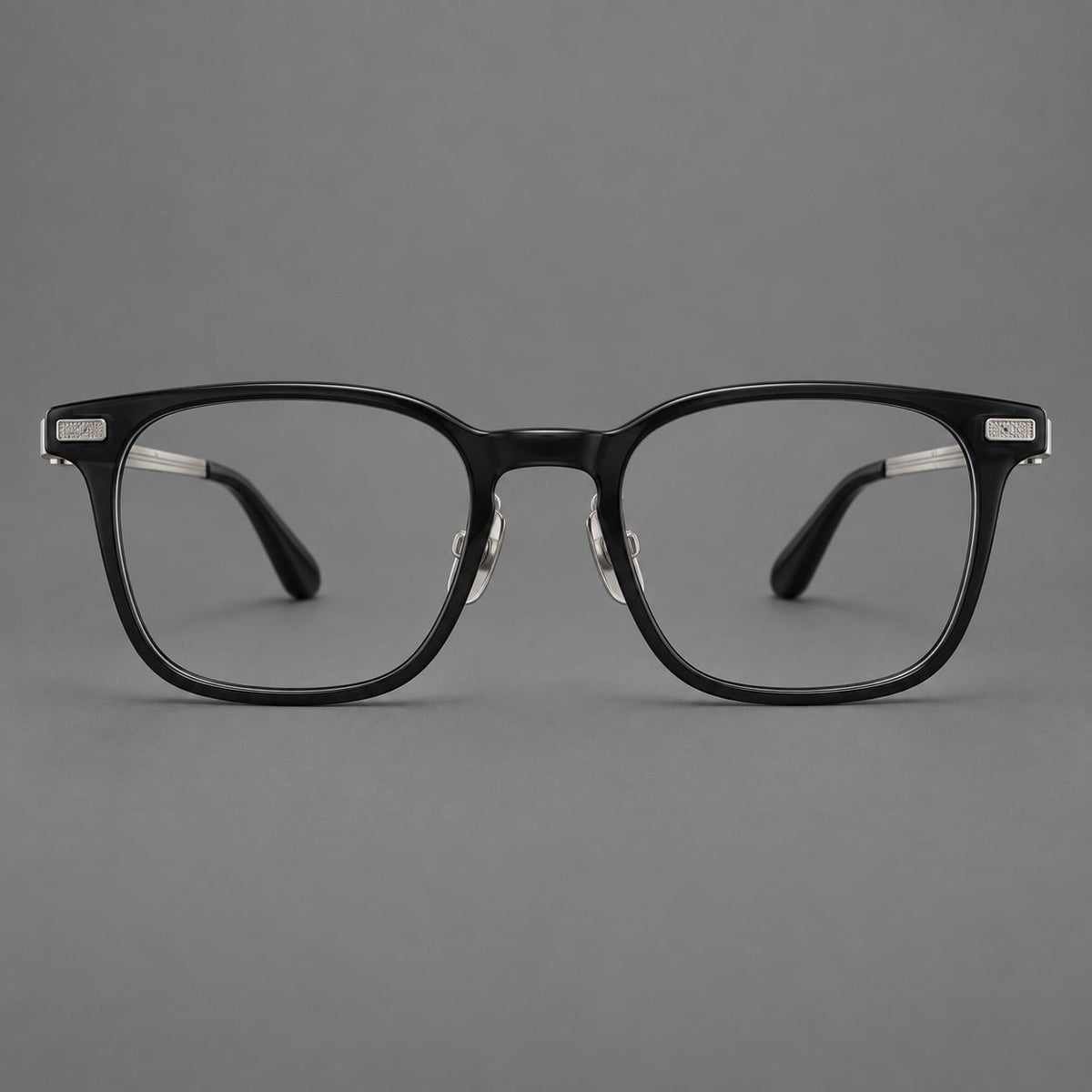 Classic acetate and titanium eyeglasses with rounded square rims and textured corner accents in Black / Silver, front view