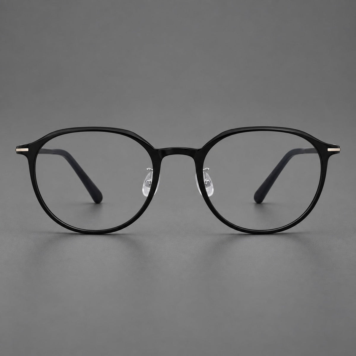 Retro round plastic eyeglasses with a curved bridge and slim metal corner accents in Glossy Black, front view