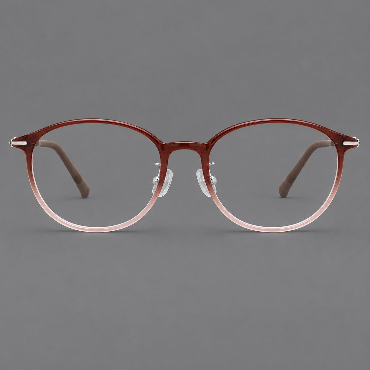 Slim oval plastic eyeglasses with a low profile and subtle metal corner accents in Red Brown Gradient, front view