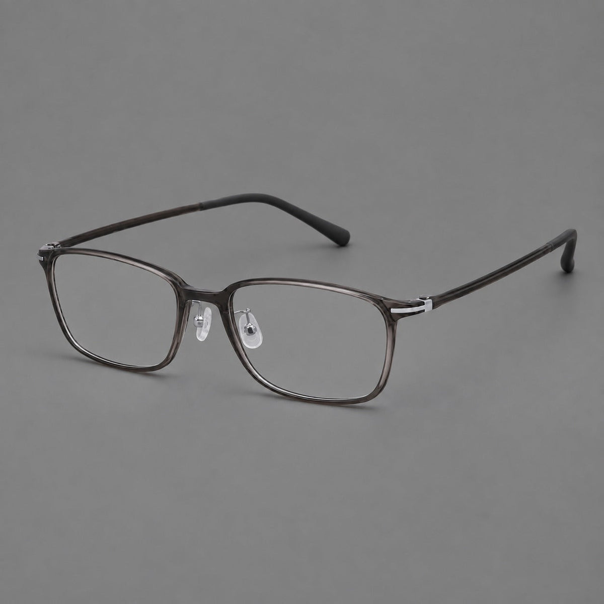 Low profile rectangular plastic eyeglasses with a straight browline and slim temples in Dark Gray, three quarter view