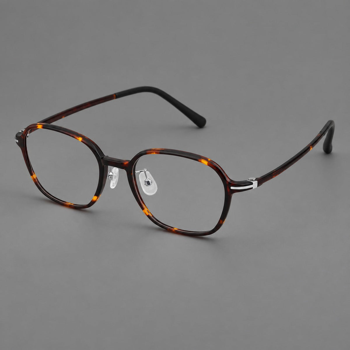 Rounded geometric plastic eyeglasses with softly angled rims and a curved bridge in Tortoiseshell, three quarter view