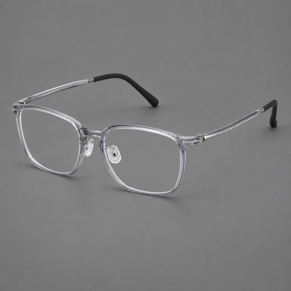 Bold square plastic eyeglasses with a defined browline and an open bridge in Clear Gray, three quarter view