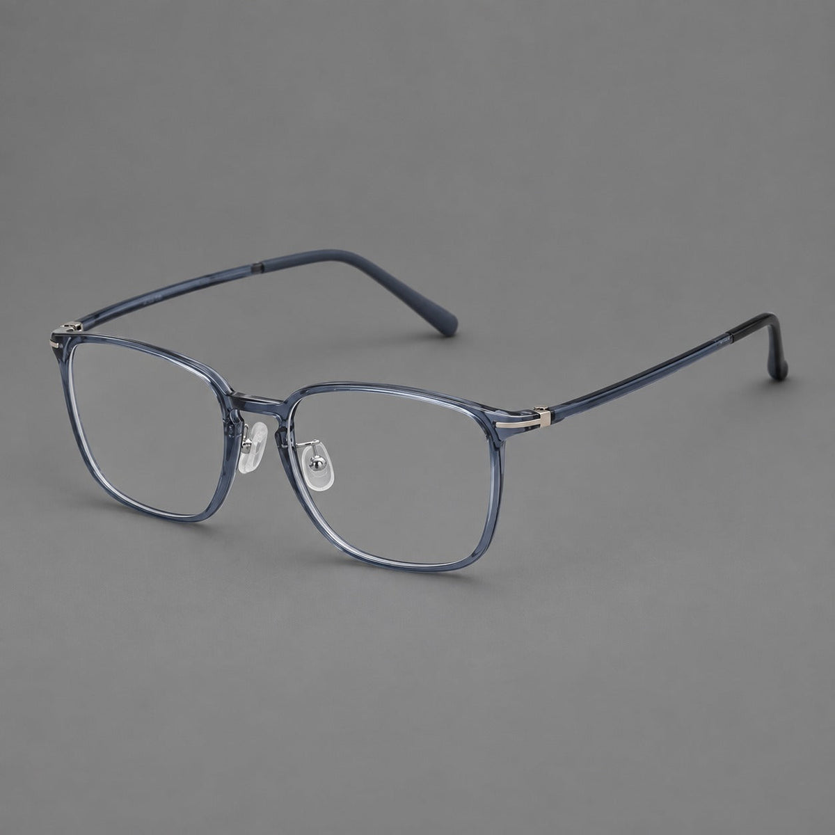 Bold square plastic eyeglasses with a defined browline and an open bridge in Slate Blue, three quarter view