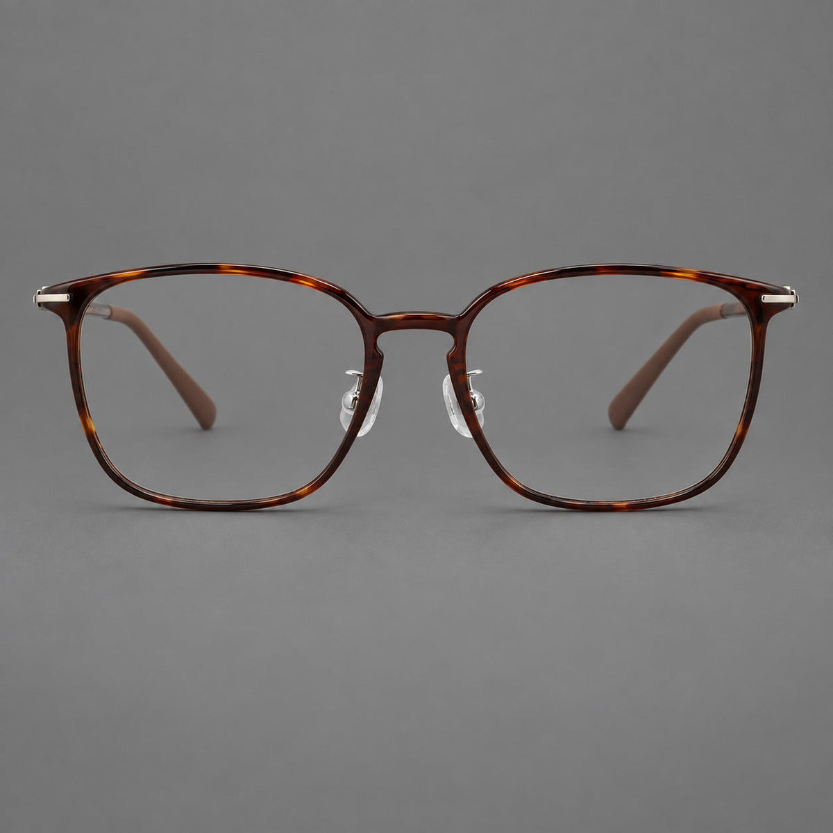Bold square plastic eyeglasses with a defined browline and an open bridge in Tortoiseshell, front view