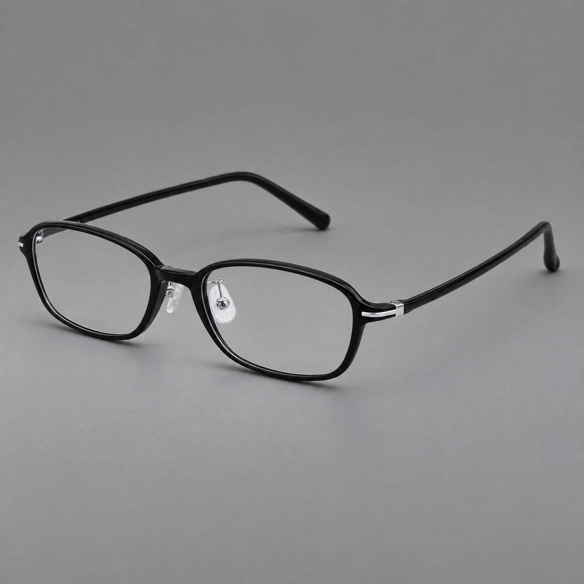 Soft oval plastic eyeglasses with a narrow bridge and gently rounded outer corners in Glossy Black, three quarter view