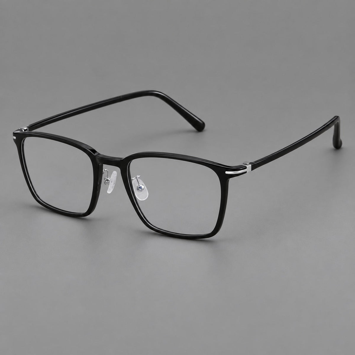 Modern square plastic eyeglasses with a smooth browline and slim metal corner details in Glossy Black, three quarter view