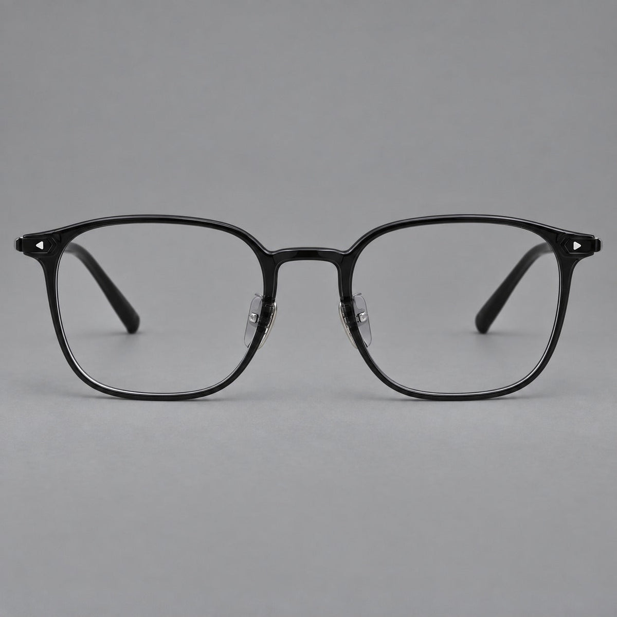 Retro square plastic eyeglasses with a curved bridge and triangular corner details in Glossy Black, front view