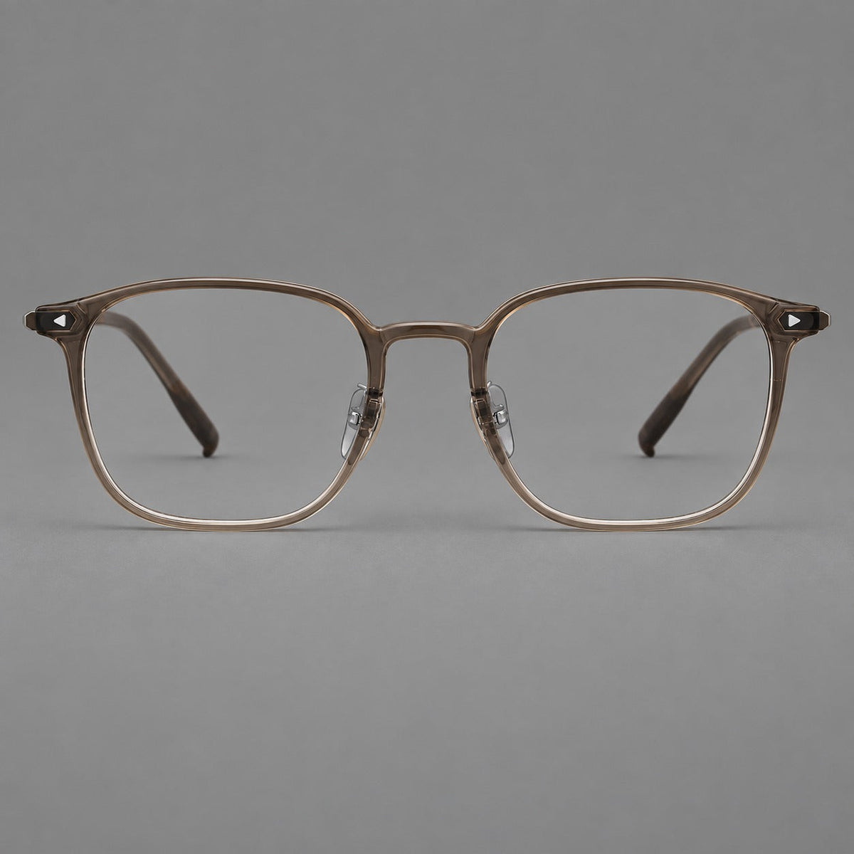 Retro square plastic eyeglasses with a curved bridge and triangular corner details in Brown, front view