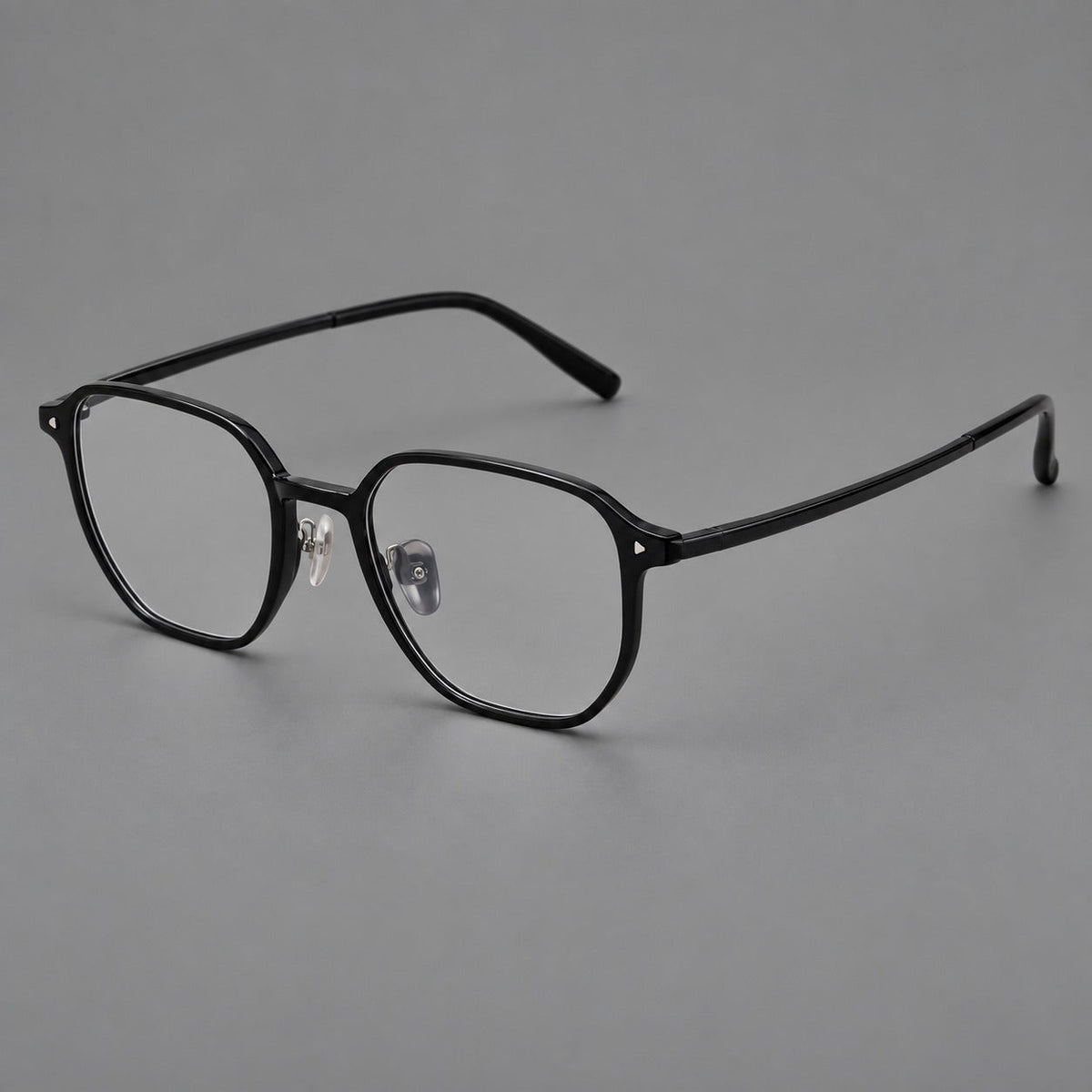 Soft square plastic eyeglasses with rounded lower rims and a broad curved bridge in Glossy Black, three quarter view