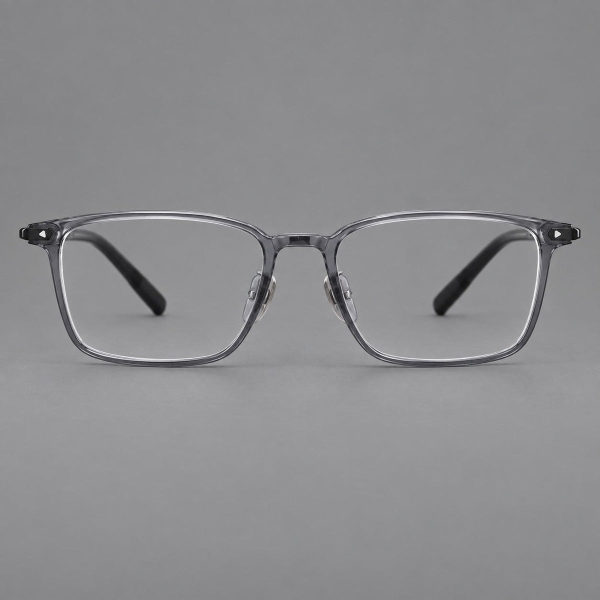 Clean rectangular plastic eyeglasses with flat lower rims and pointed corner details in Ink Gray, front view