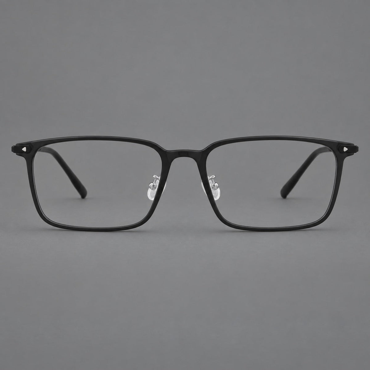 Wide rectangular plastic eyeglasses with an angular browline and slender rims in Matte Black, front view