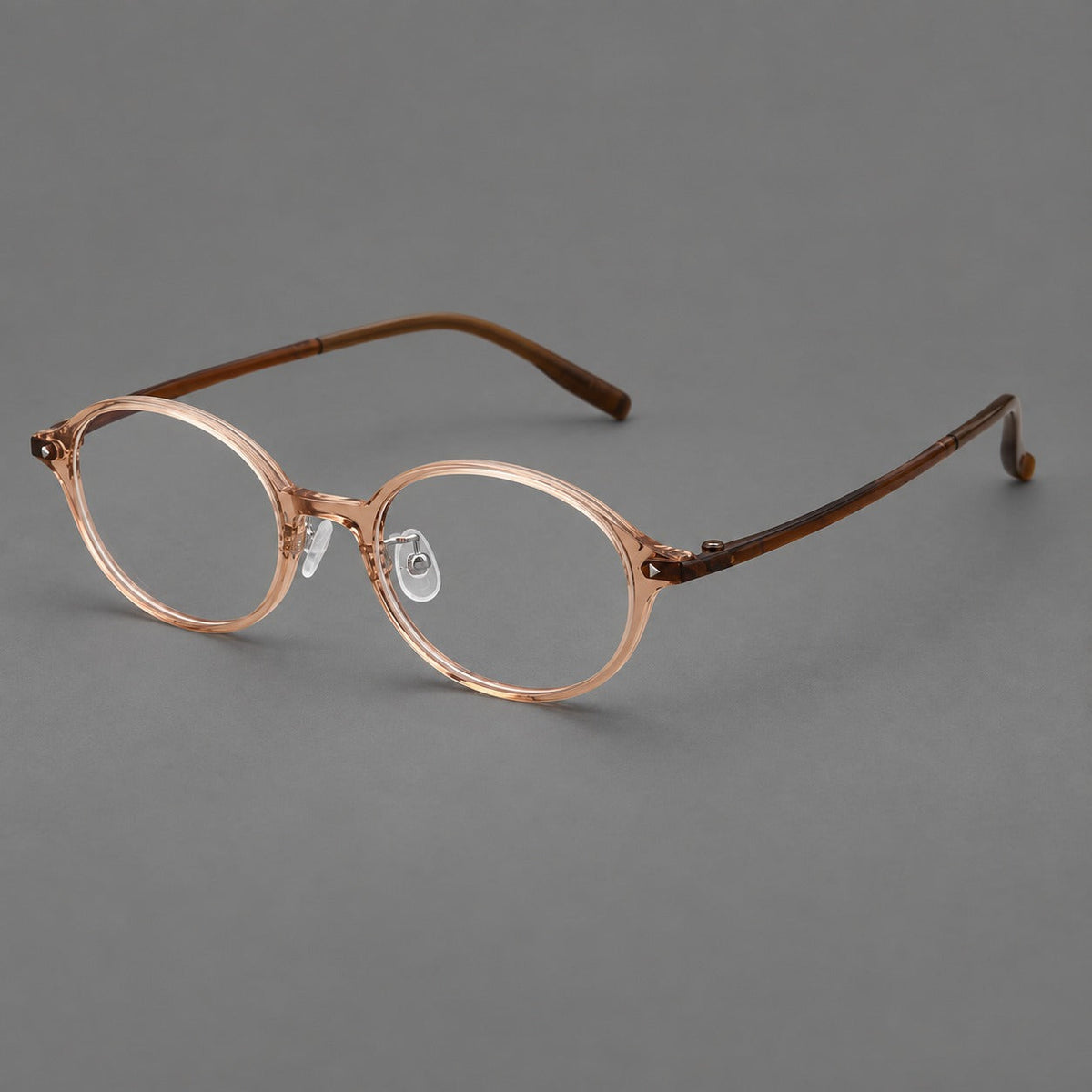 Retro round plastic eyeglasses with softly lifted corners and a sculpted bridge in Tea, three quarter view