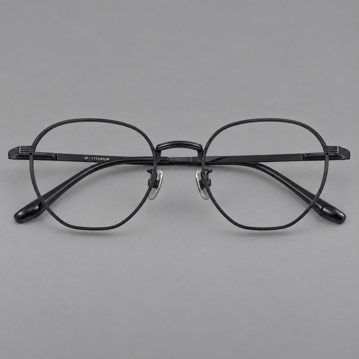 Retro panto titanium glasses with a curved bridge and fine parallel rim grooves in Black, front view