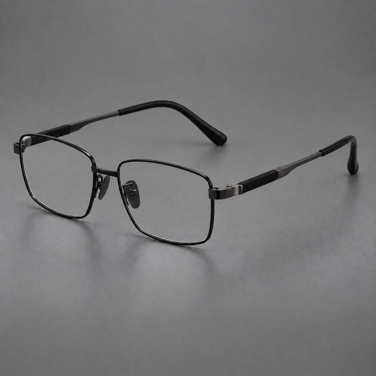 Slim rectangular titanium glasses with broad temples and contrasting dark inserts in Black, three quarter view
