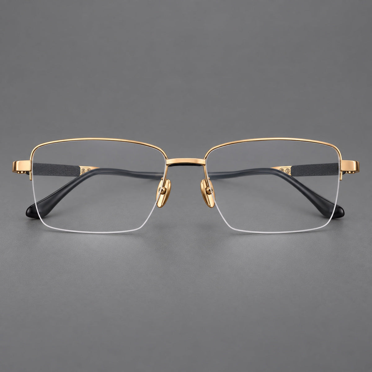 Wide half frame titanium glasses with rectangular lenses and textured temples in Gold, front view