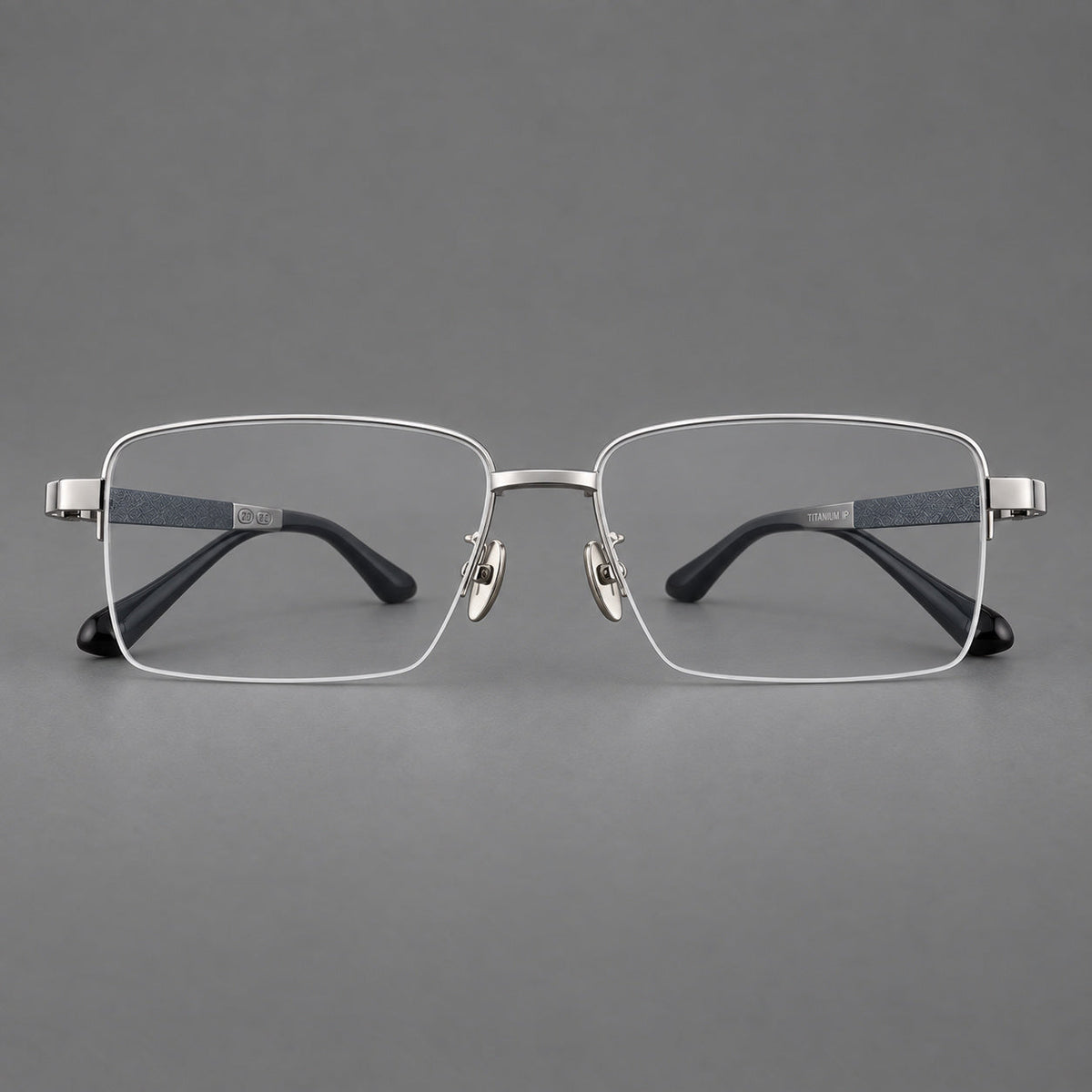 Wide half frame titanium glasses with rectangular lenses and textured temples in Silver, front view