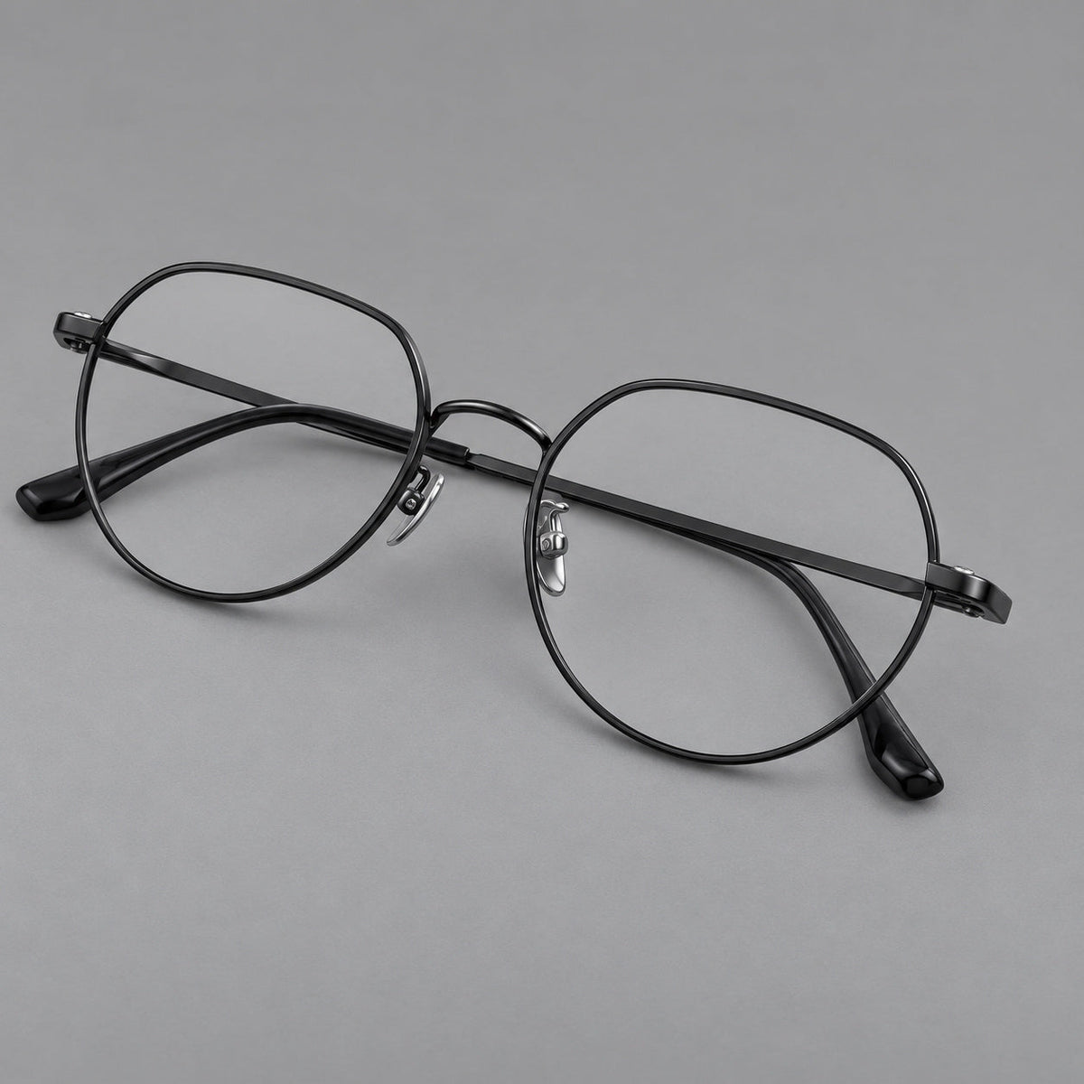 Classic panto titanium glasses with a curved bridge and slim straight temples in Black, three quarter view