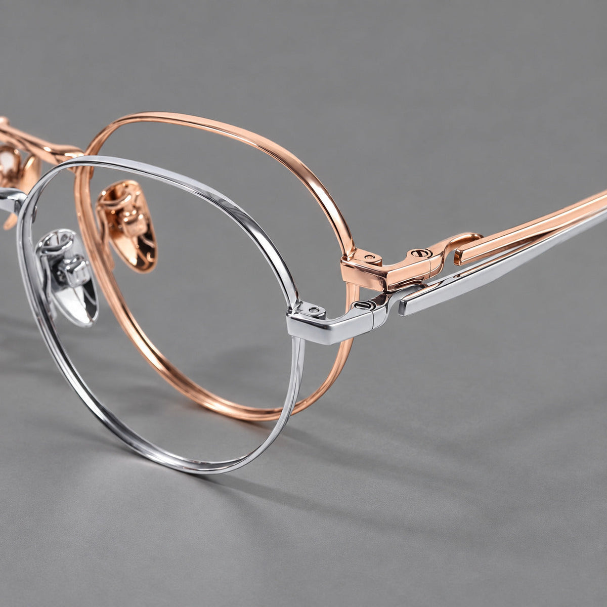 Small panto titanium glasses with an angular bridge and recessed temple details, frame details