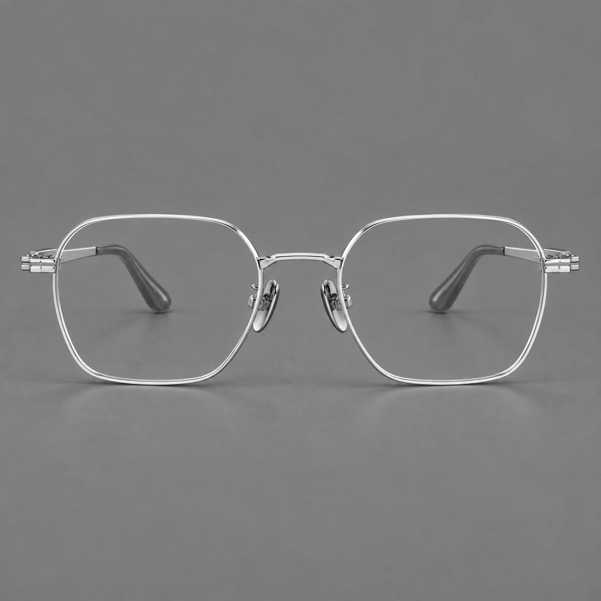 Soft square titanium glasses with an angular bridge and layered corner details in Silver, front view