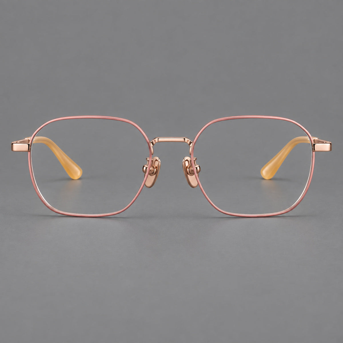 Rounded panto titanium glasses with an angular bridge and broad flat temples in Pink and Rose Gold, front view