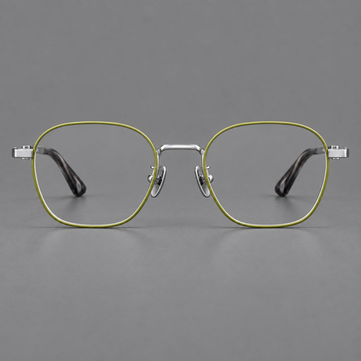 Rounded panto titanium glasses with an angular bridge and broad flat temples in Green and Silver, front view