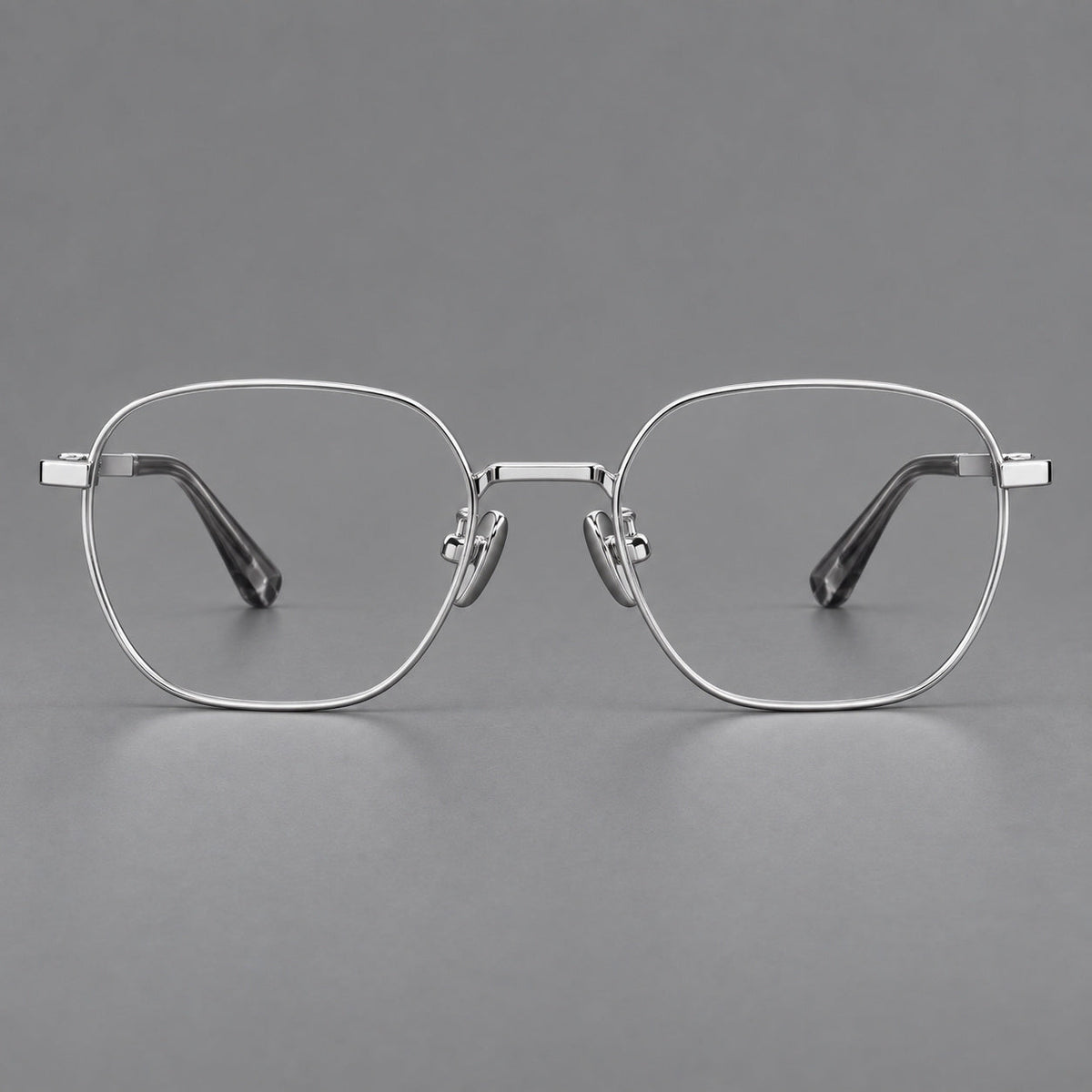 Rounded panto titanium glasses with an angular bridge and broad flat temples in Silver, front view