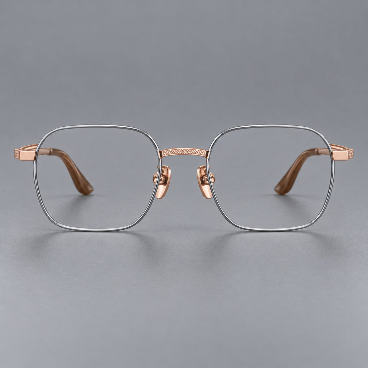Geometric square titanium glasses with a textured bridge and fine temple grooves in Gray and Rose Gold, front view