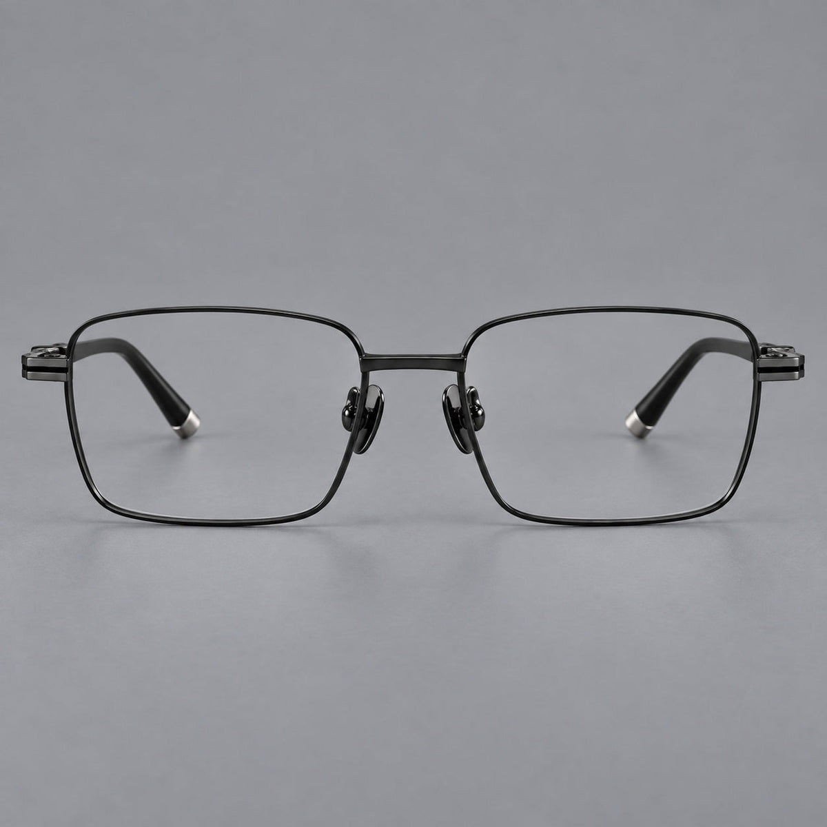 Rectangular titanium glasses with inset corner lines and metal capped temple tips in Black, front view