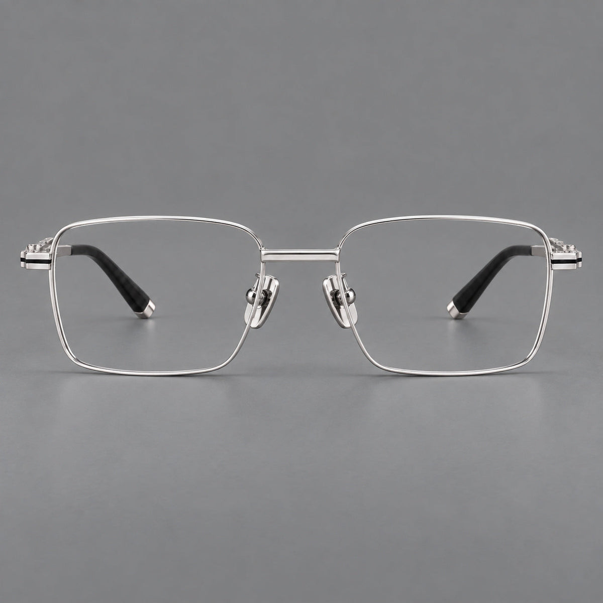 Rectangular titanium glasses with inset corner lines and metal capped temple tips in Silver, front view