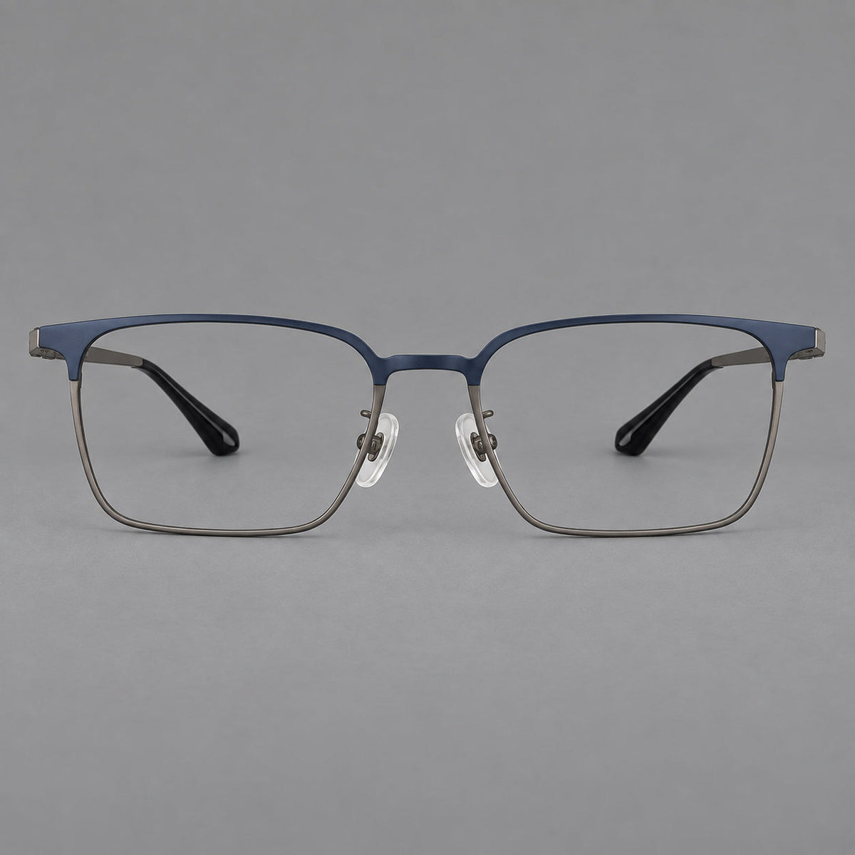 Bold rectangular titanium glasses with strong upper corners and flat metal temples in Blue and Gunmetal, front view