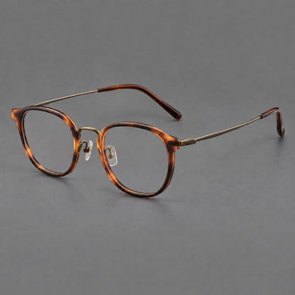 Retro soft square eyeglasses in acetate and titanium with a curved bridge and slender temples in Amber Tortoiseshell / Antique Gold, three quarter view